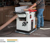 Woodworker feeding hardwood board into JET JPJ-12B combo planer-jointer with labeled parts.