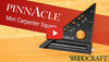 Mini Pinnacle Carpenter Square with angle markings and drill guide holes on wood surface