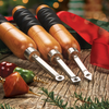 Set of three woodturning tools with wooden handles and metal gouges on rustic wood surface with festive decorations and red