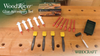 WoodRiver glue syringes, red mixing nozzles, yellow glue brushes, and a small paint roller on a woodworking bench.