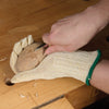 Woodworker chip carving a Basswood Easter egg.